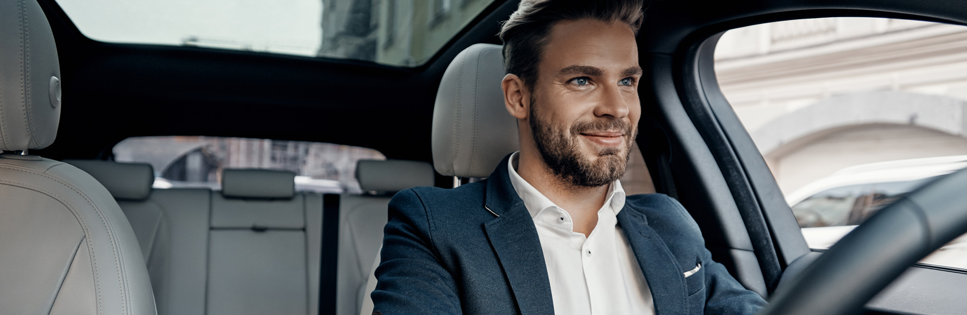 Businessman driving a rental car